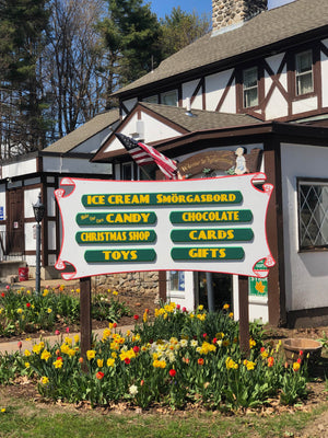 Entrance to Kellerhaus with sign and spring flowers
