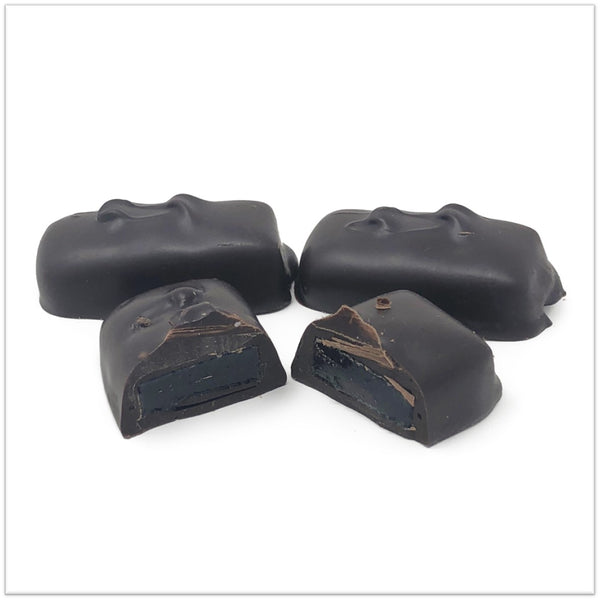 Dark Chocolate covered raspberry jelly cut in half.