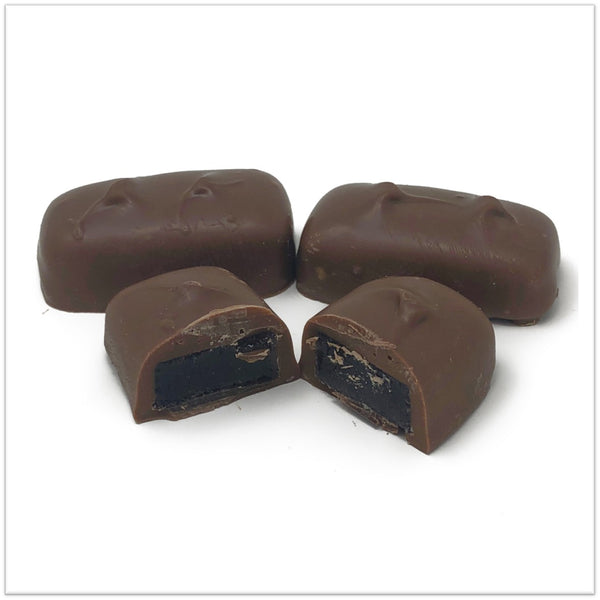 Milk Chocolate covered raspberry jelly cut in half.