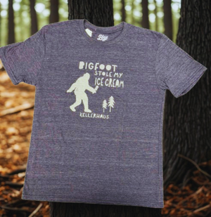 Triblend Navy sleeve t-shirt with a bigfoot silhouette and trees. Words on shirt say Bigfood stole my ice cream Kellerhaus