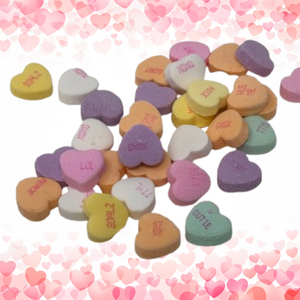 Pink, Yellow, Green, Orange, White and Purple Heart shaped candy with cute sayings printing on them. "cutie", "NICE", "XOXO", "LOL", "PEACE", etc. 