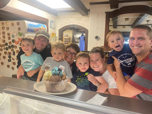 Family posing with Kellerhaus Colossus ice cream sundae