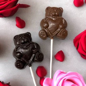 Dark and Milk Chocolate Bear holding a heart pops.