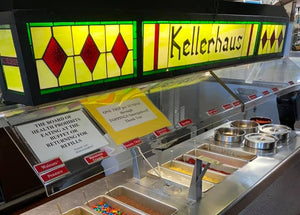 Dessert bar with stained glass sign reading 'Kellerhaus' in a casual dining setting.