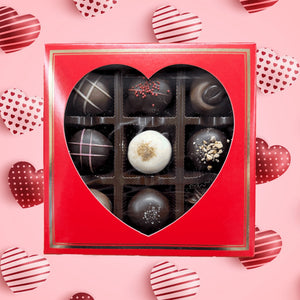 Red 9 piece chocolate box with heart shaped window.