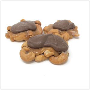 Three milk chocolate caramel cashew clusters.